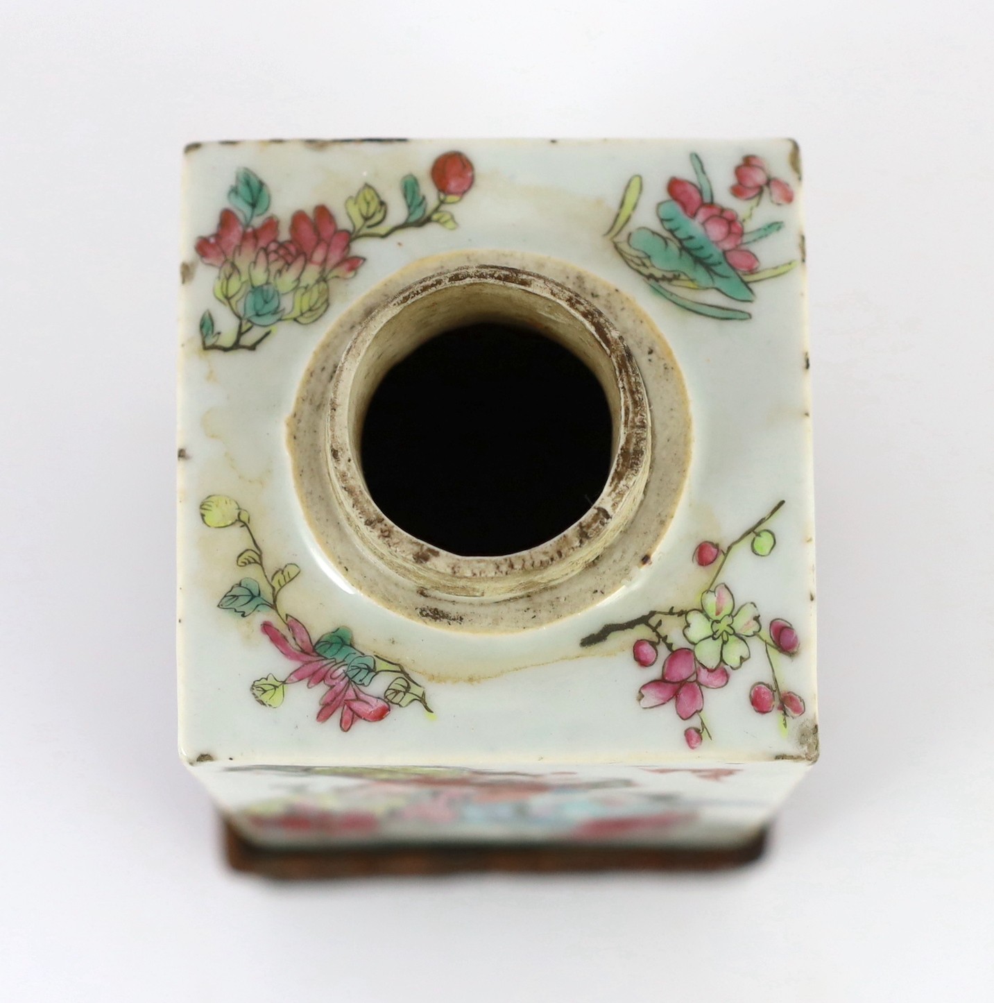 A Chinese famille rose square tea caddy, mid 19th century, 13.7cm high excluding wood stand and cover, slight damage